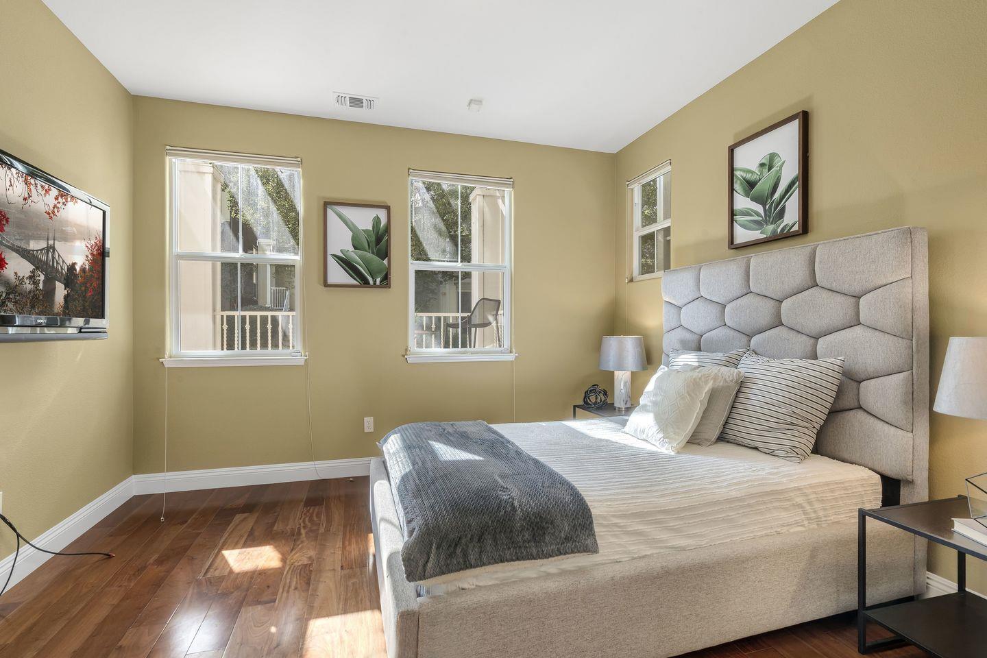 129 Azalea Drive Mountain View, CA 94041 - Photo 18 of 53 a bedroom with a bed and a painting on the wall