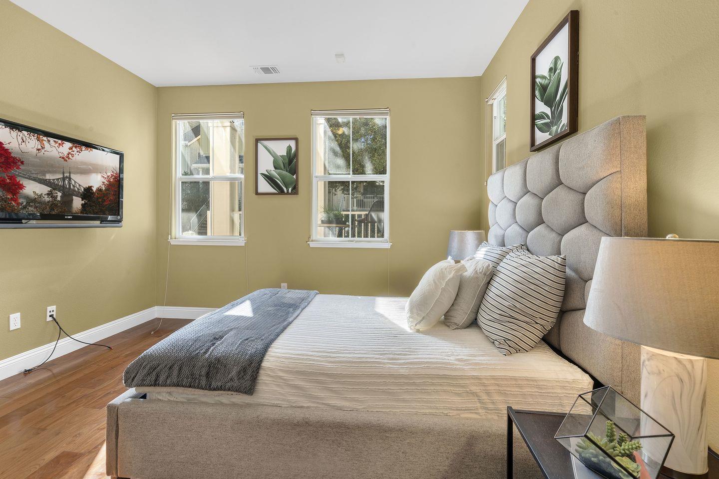 129 Azalea Drive Mountain View, CA 94041 - Photo 19 of 53 a bedroom with a large bed and a window