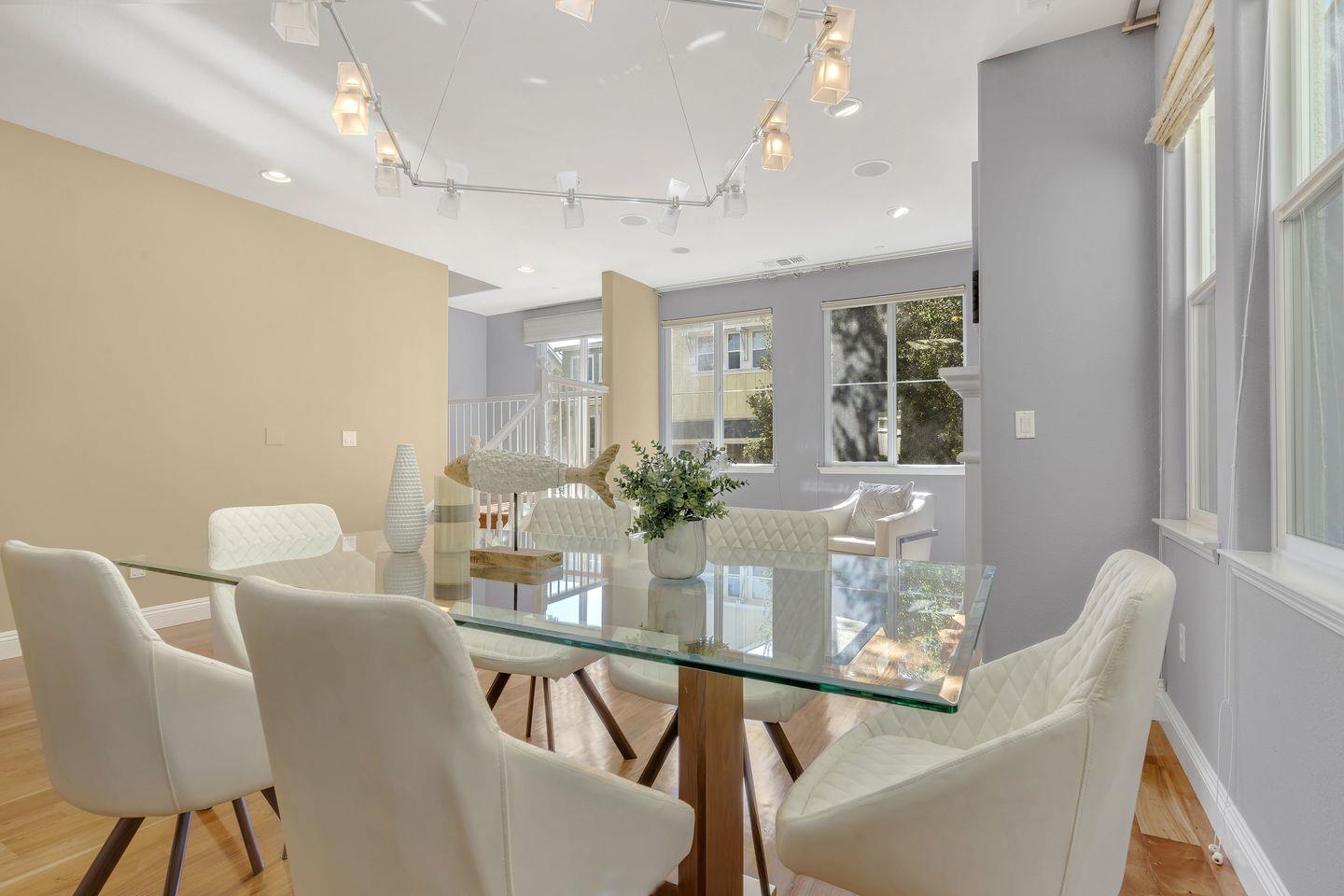 129 Azalea Drive Mountain View, CA 94041 - Photo 27 of 53 a dining room with furniture and wooden floor
