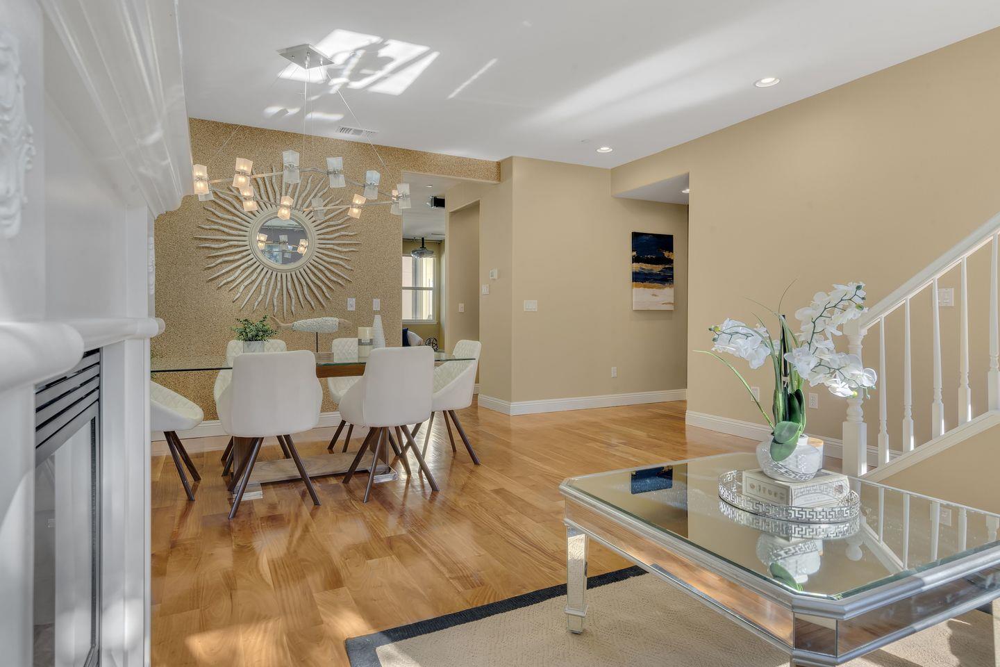 129 Azalea Drive Mountain View, CA 94041 - Photo 28 of 53 a dining room with furniture a chandelier and wooden floor