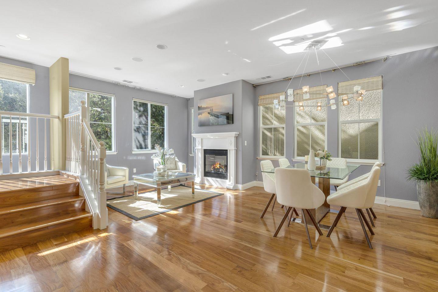 129 Azalea Drive Mountain View, CA 94041 - Photo 30 of 53 a dining room with furniture a fireplace and wooden floor