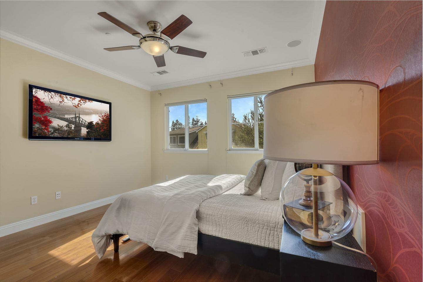 129 Azalea Drive Mountain View, CA 94041 - Photo 43 of 53 a bedroom with a bed and wooden floor