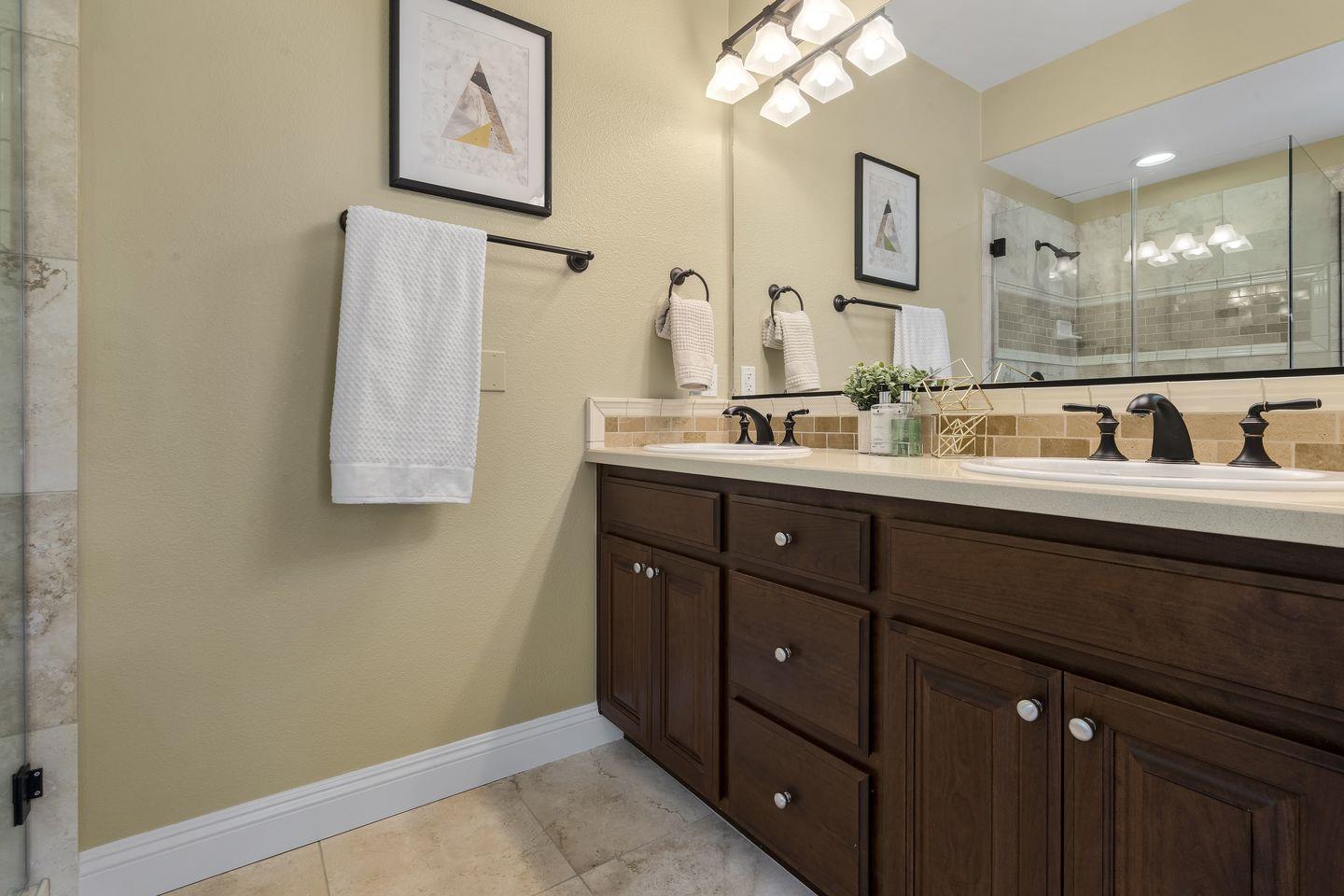 129 Azalea Drive Mountain View, CA 94041 - Photo 46 of 53 a bathroom with a double vanity sink and a mirror