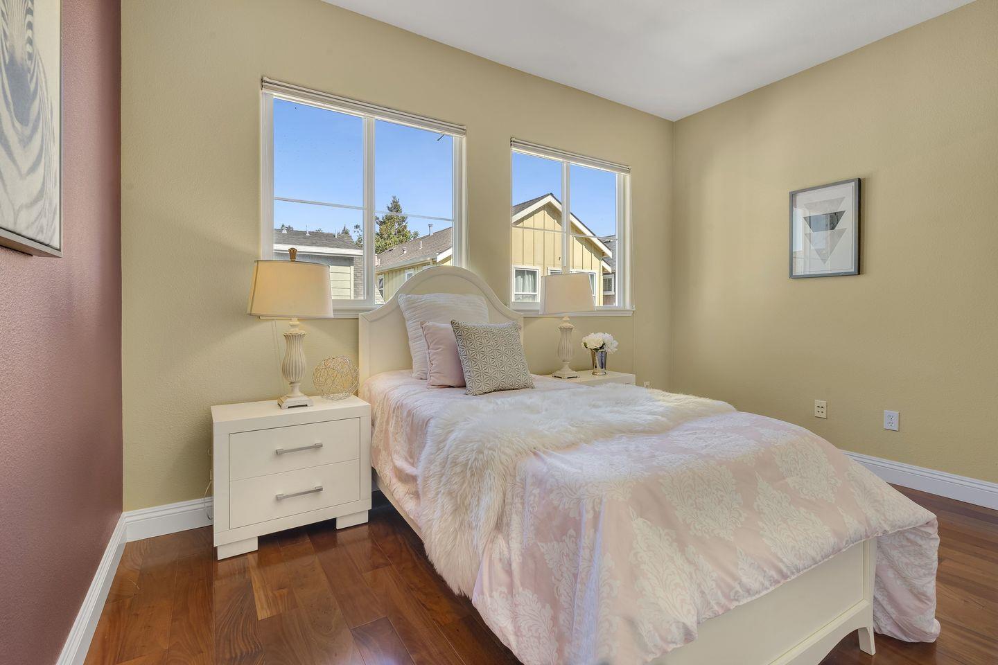 129 Azalea Drive Mountain View, CA 94041 - Photo 50 of 53 a bedroom with a bed and a night stand