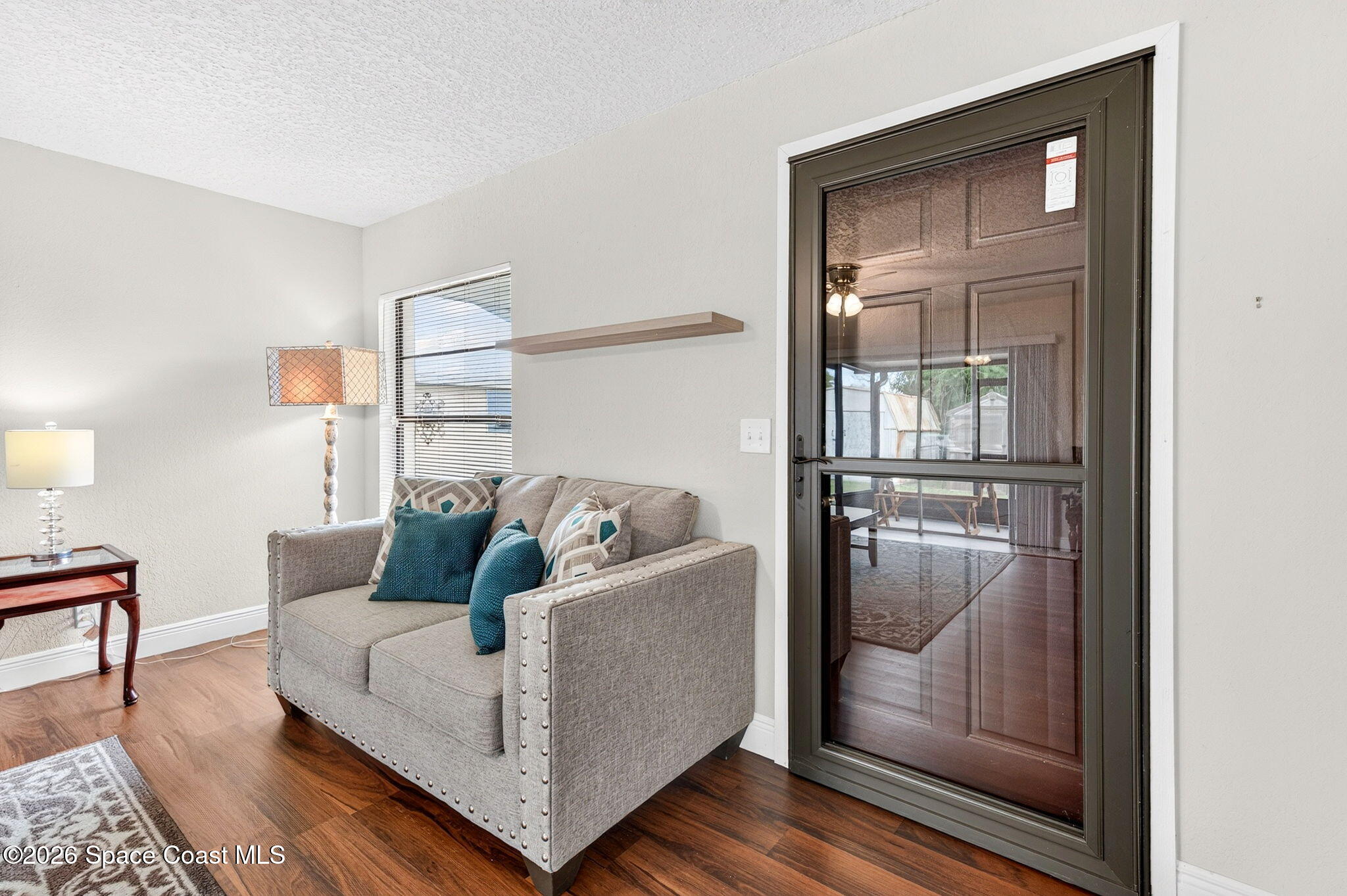 996 Botany Lane Rockledge, FL 32955 - Photo 7 of 35 a living room with furniture and a window