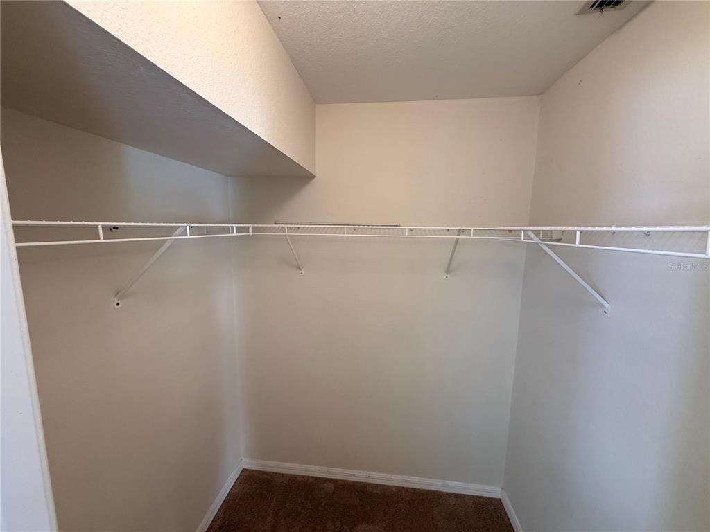 4185 Amari Road North Port, FL 34291 - Photo 11 of 14 a view of a room with racks on the wall