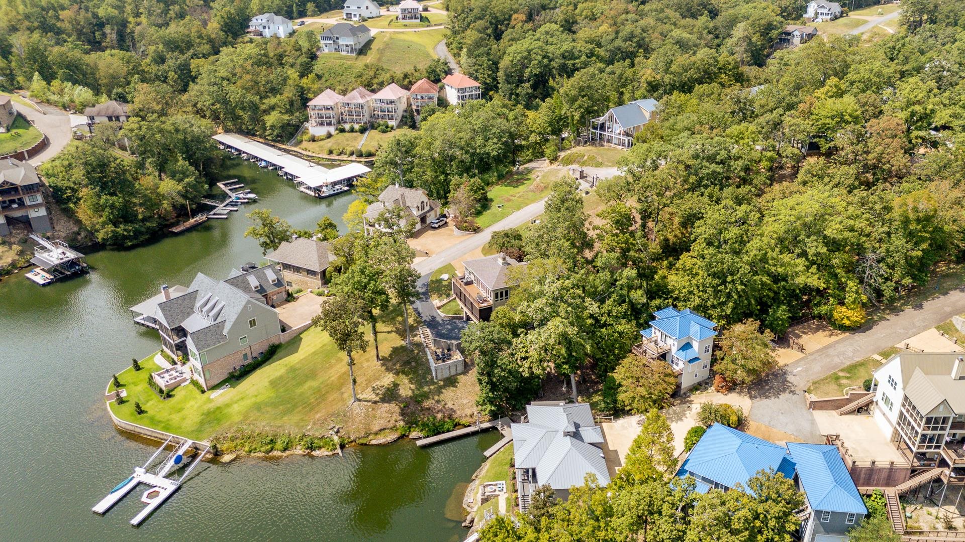 0 Quarry Hollow Pnt Road Savannah, TN 38372 - Photo 21 of 30 an aerial view of a house with a yard and lake view
