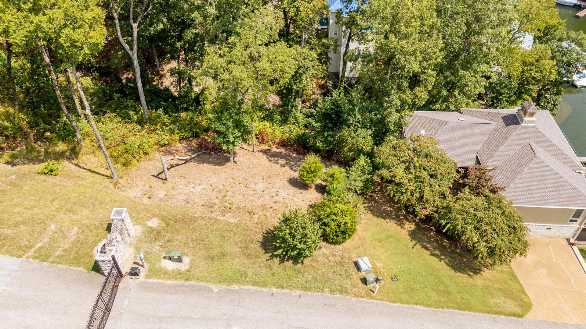 0 Quarry Hollow Pnt Road Savannah, TN 38372 - Photo 3 of 30 a view of a yard with plants and large trees