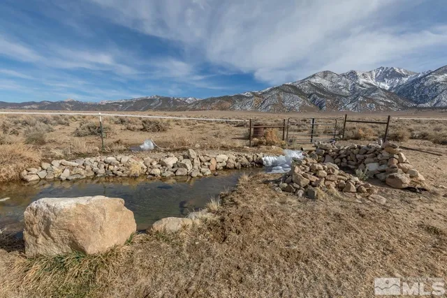 a view of a terrace with a table and chairs