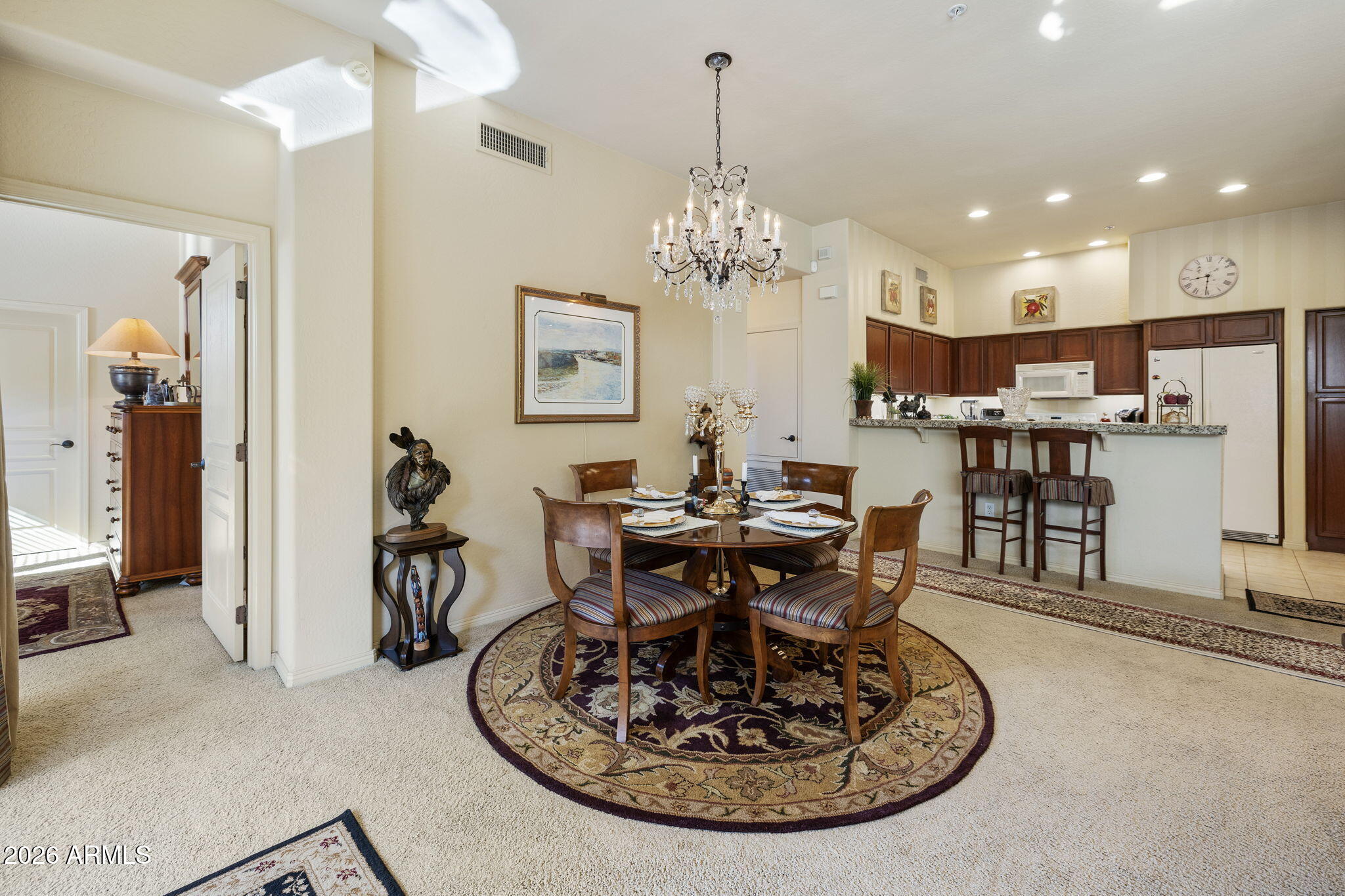 2989 North 44th Street, Unit 3018 Phoenix, AZ 85018 - Photo 12 of 45 a view of a dining room with furniture