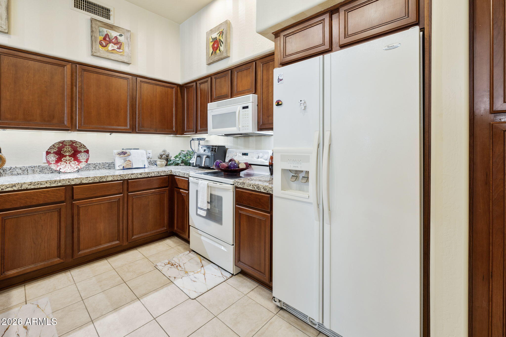 2989 North 44th Street, Unit 3018 Phoenix, AZ 85018 - Photo 13 of 43 a kitchen with stainless steel appliances a sink and a refrigerator