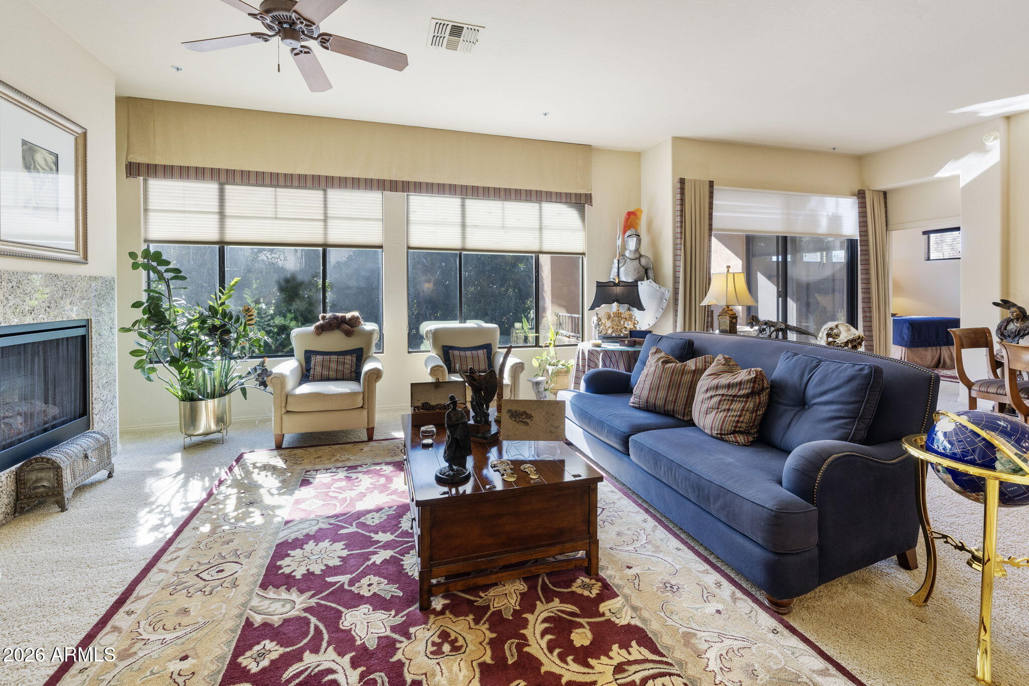 2989 North 44th Street, Unit 3018 Phoenix, AZ 85018 - Photo 17 of 45 a living room with furniture and a large window