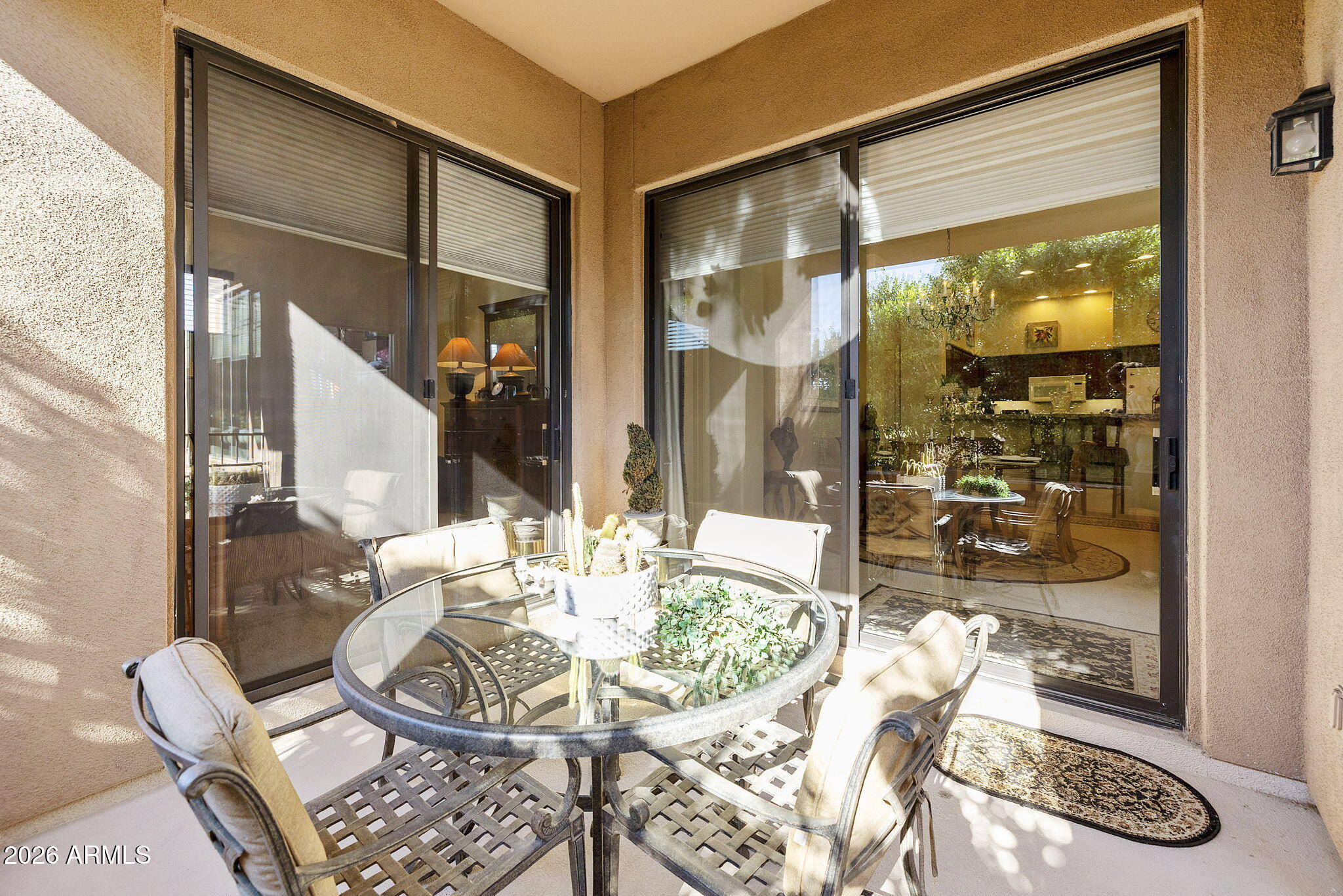 2989 North 44th Street, Unit 3018 Phoenix, AZ 85018 - Photo 20 of 45 a view of a dining room with furniture wooden floor and a floor to ceiling window