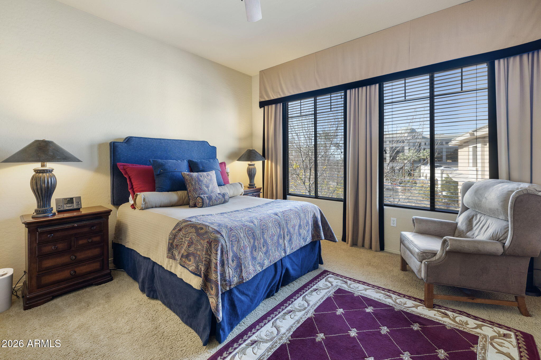 2989 North 44th Street, Unit 3018 Phoenix, AZ 85018 - Photo 22 of 45 a spacious bedroom with a large bed and a couch