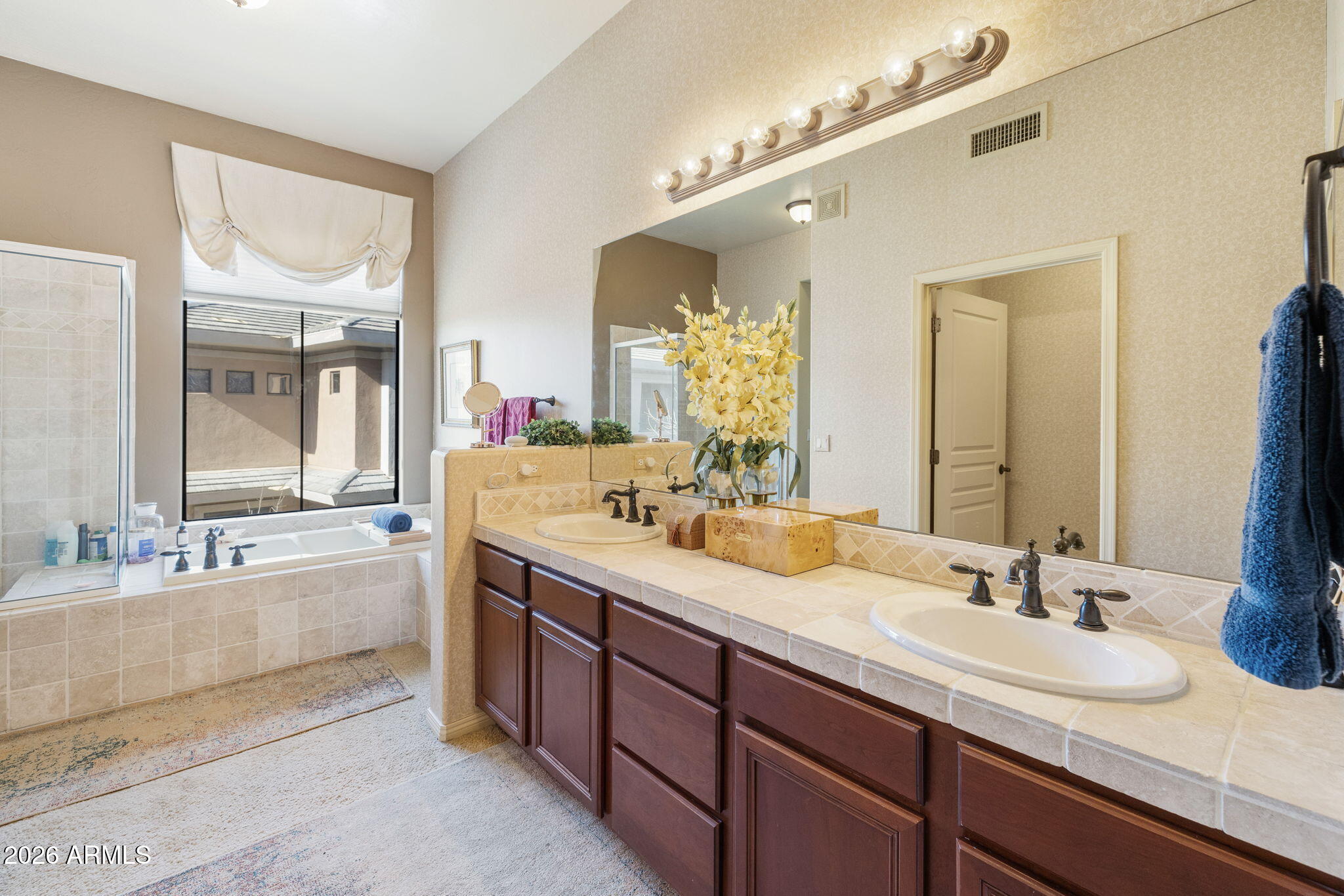 2989 North 44th Street, Unit 3018 Phoenix, AZ 85018 - Photo 25 of 45 a bathroom with a granite countertop sink mirror and double
