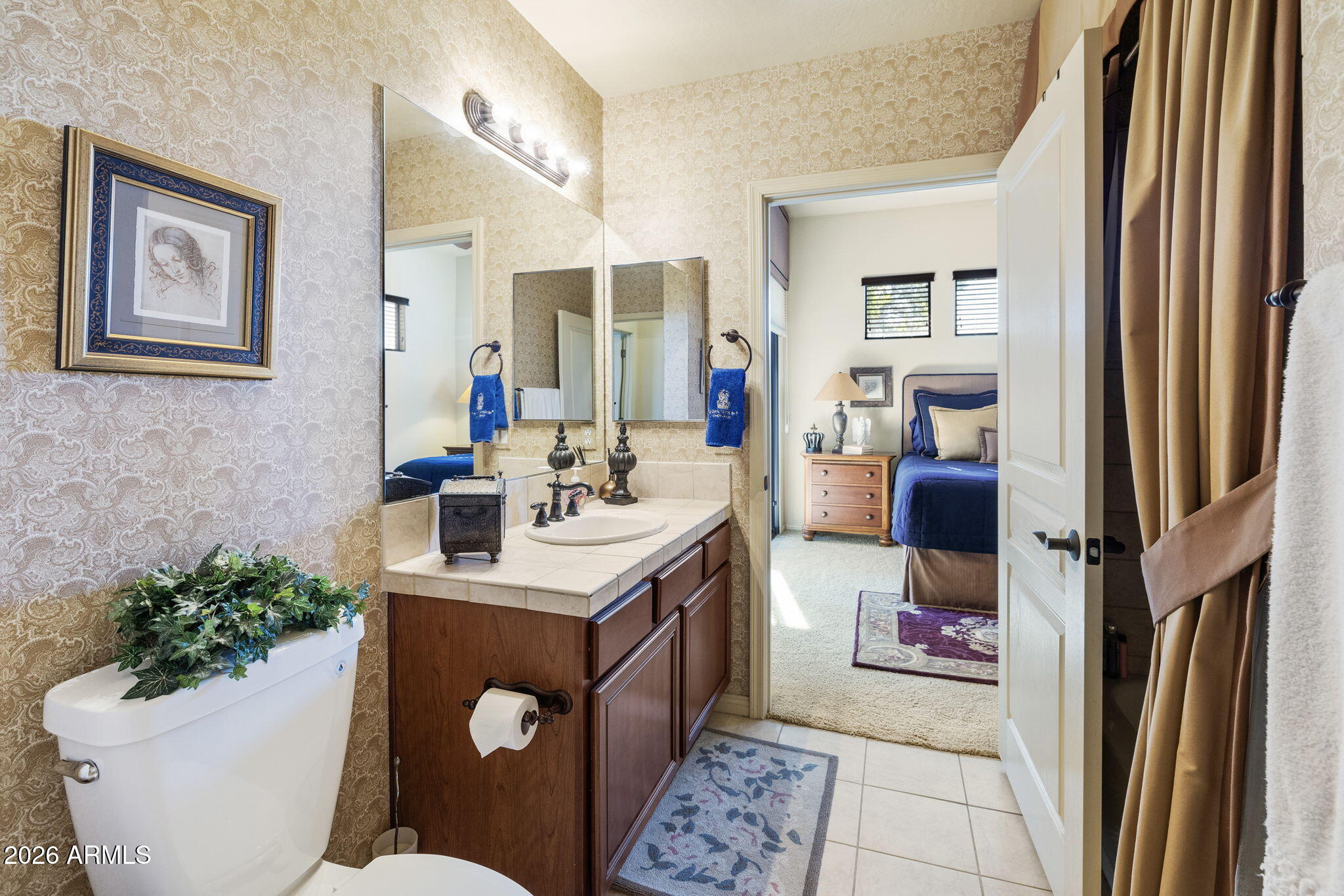2989 North 44th Street, Unit 3018 Phoenix, AZ 85018 - Photo 27 of 45 a bathroom with a sink toilet and mirror