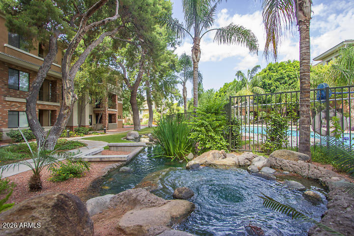 2989 North 44th Street, Unit 3018 Phoenix, AZ 85018 - Photo 30 of 43 a view of a garden with a patio