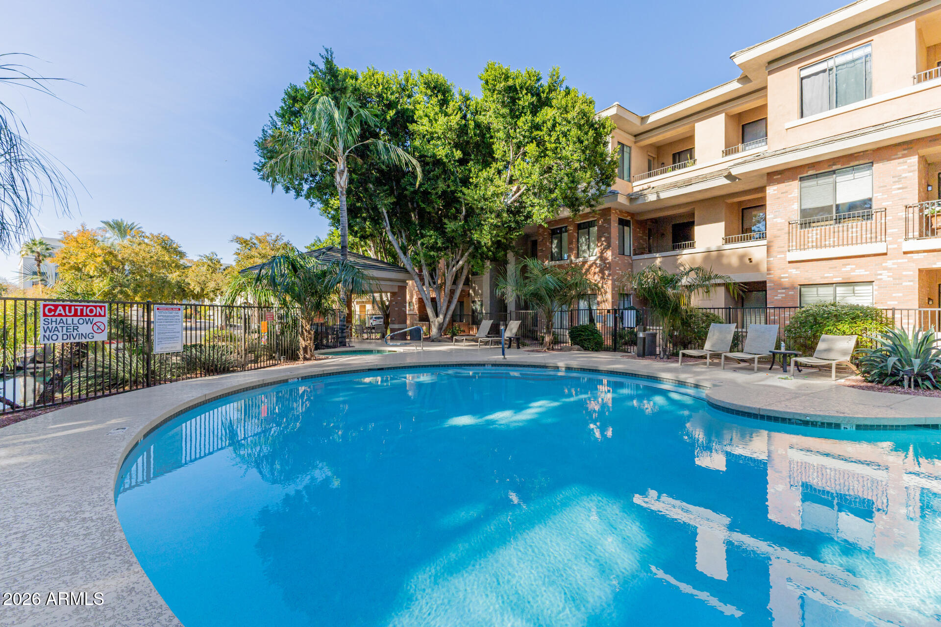 2989 North 44th Street, Unit 3018 Phoenix, AZ 85018 - Photo 33 of 45 a view of pool with outdoor seating