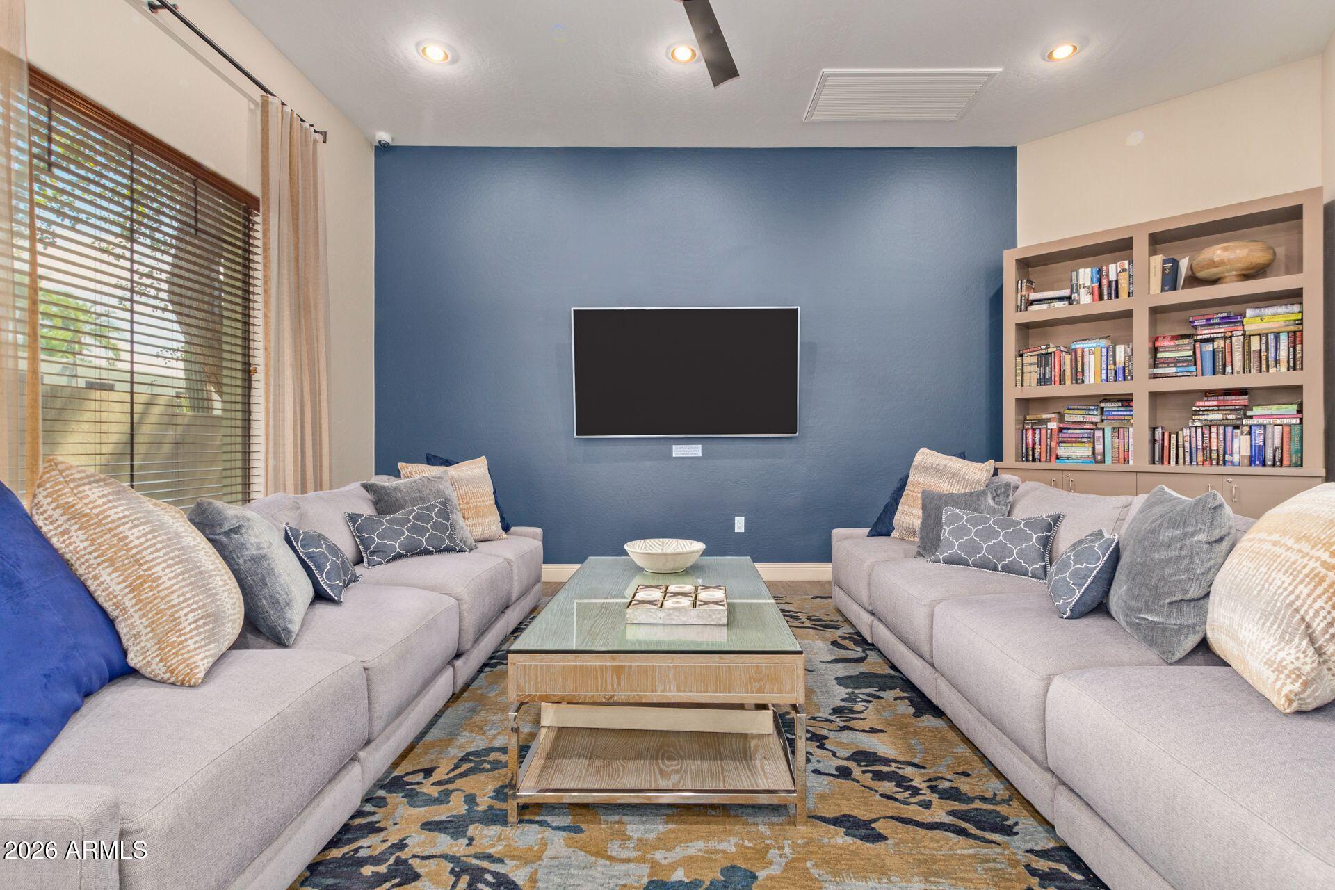 2989 North 44th Street, Unit 3018 Phoenix, AZ 85018 - Photo 38 of 45 a living room with furniture and a flat screen tv