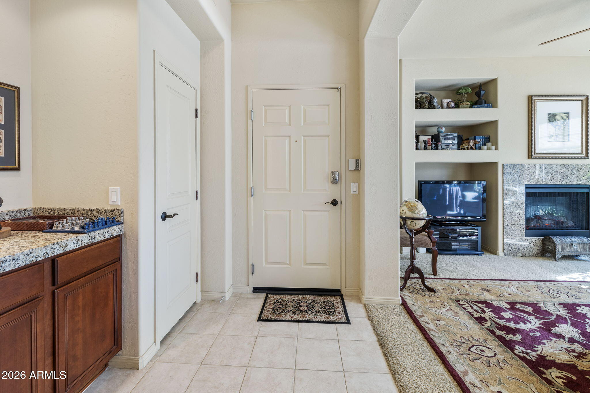 2989 North 44th Street, Unit 3018 Phoenix, AZ 85018 - Photo 10 of 45 a view of a hallway with furniture and wooden floor