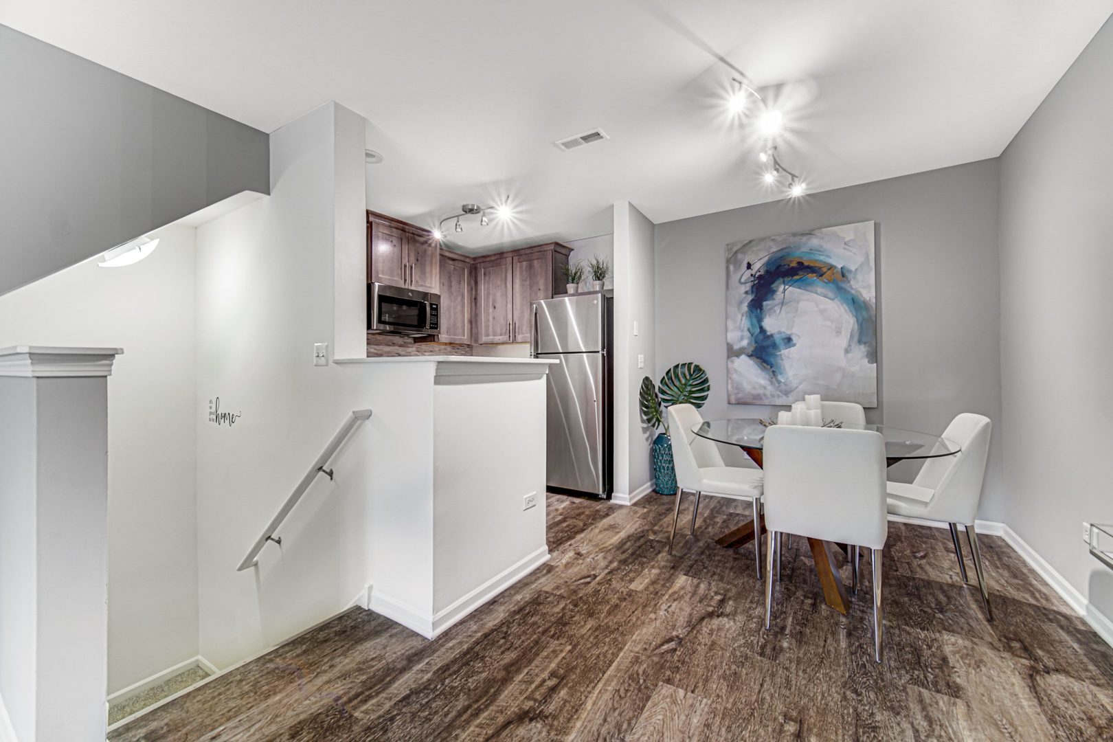 402 Mozart Court, Unit 402 Wheaton, IL 60189 - Photo 5 of 13 a dining room with furniture and wooden floor