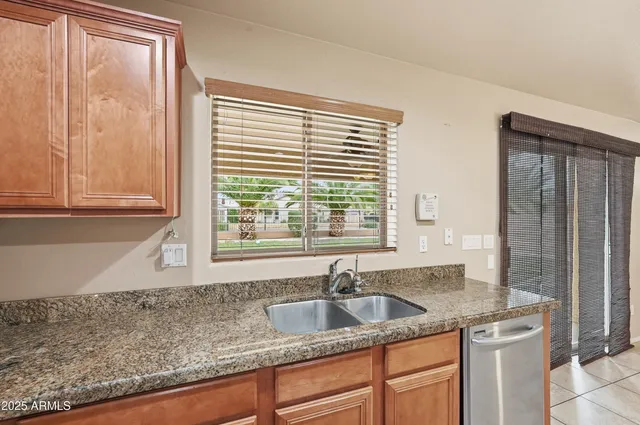 a bathroom with a sink double vanity and a mirror