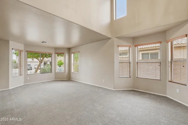 a kitchen with stainless steel appliances granite countertop a stove top oven a refrigerator and a sink