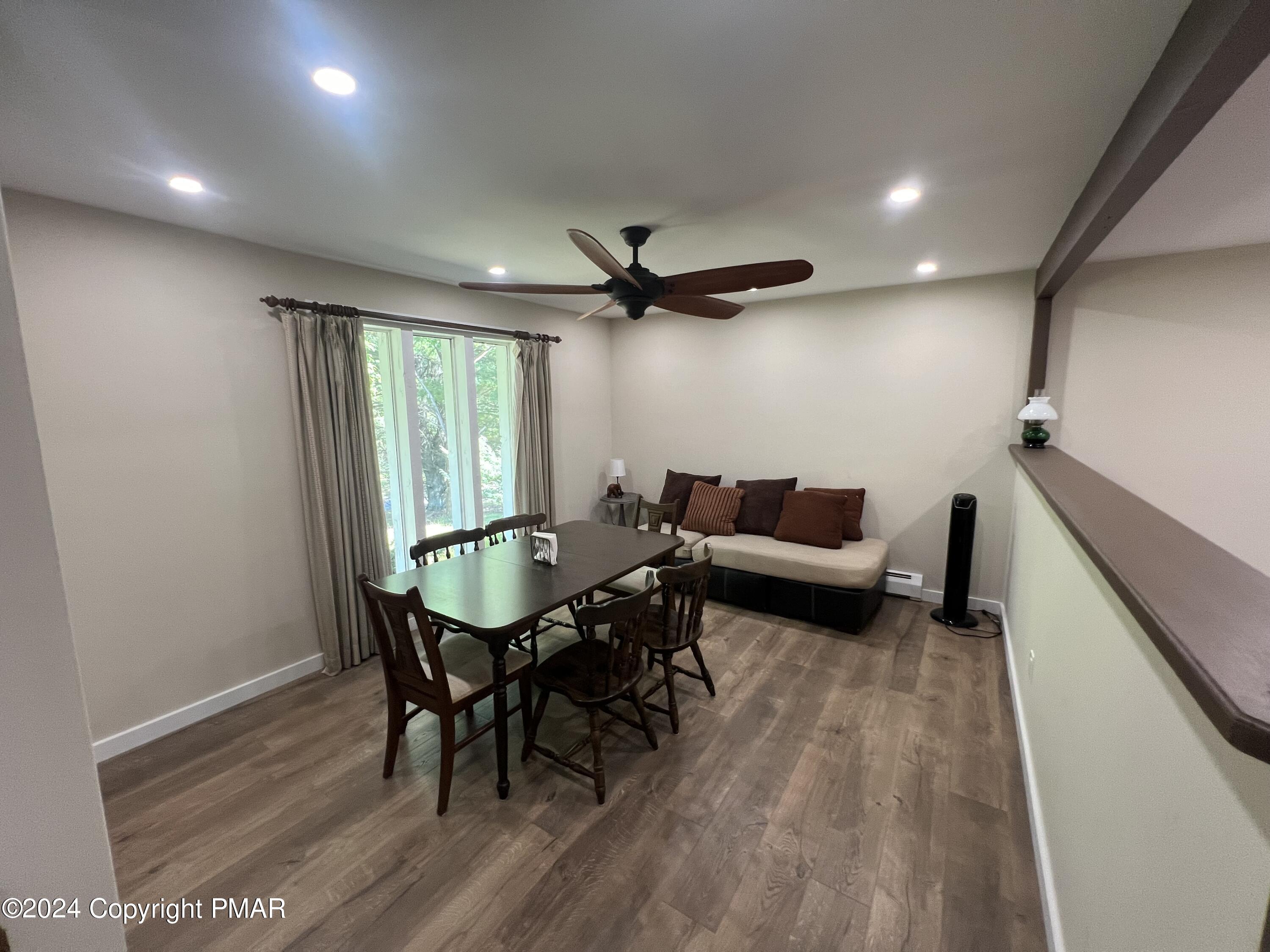 83 Balson Road Stroudsburg, PA 18360 - Photo 11 of 37 a living room with furniture a window and a table