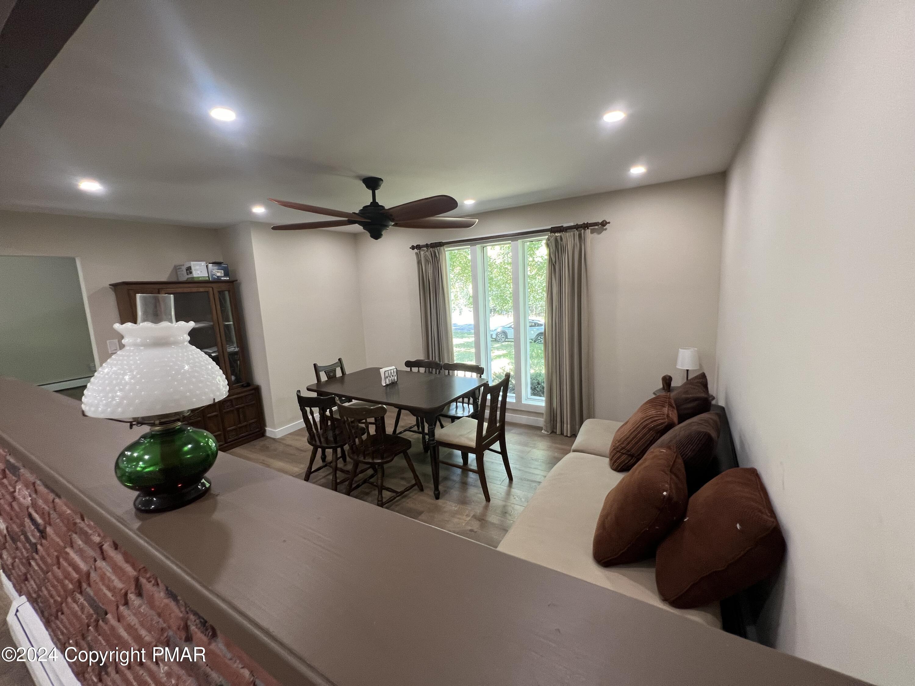 83 Balson Road Stroudsburg, PA 18360 - Photo 12 of 37 a living room with furniture and a potted plant