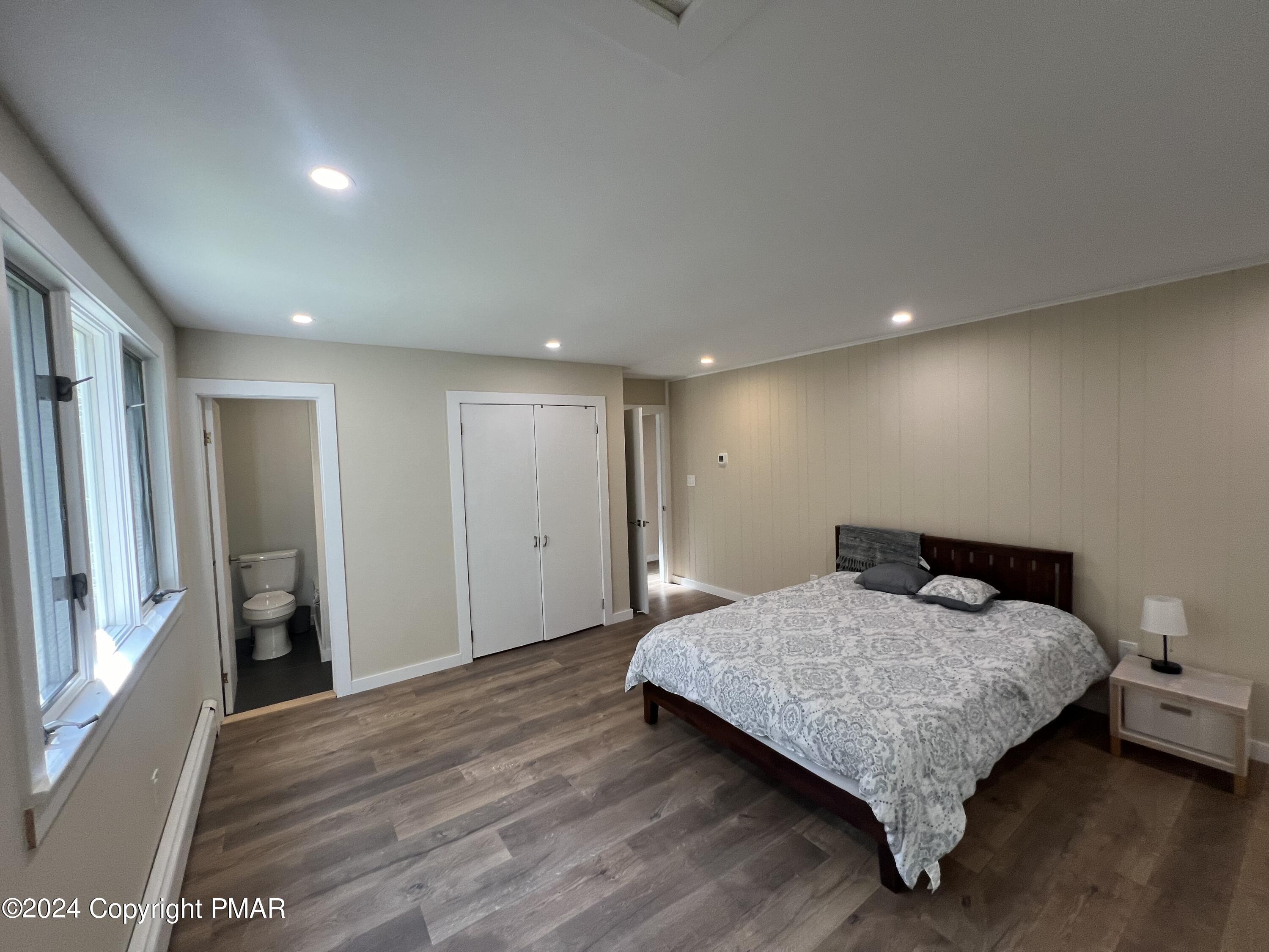 83 Balson Road Stroudsburg, PA 18360 - Photo 15 of 37 a bedroom with a bed and a large window