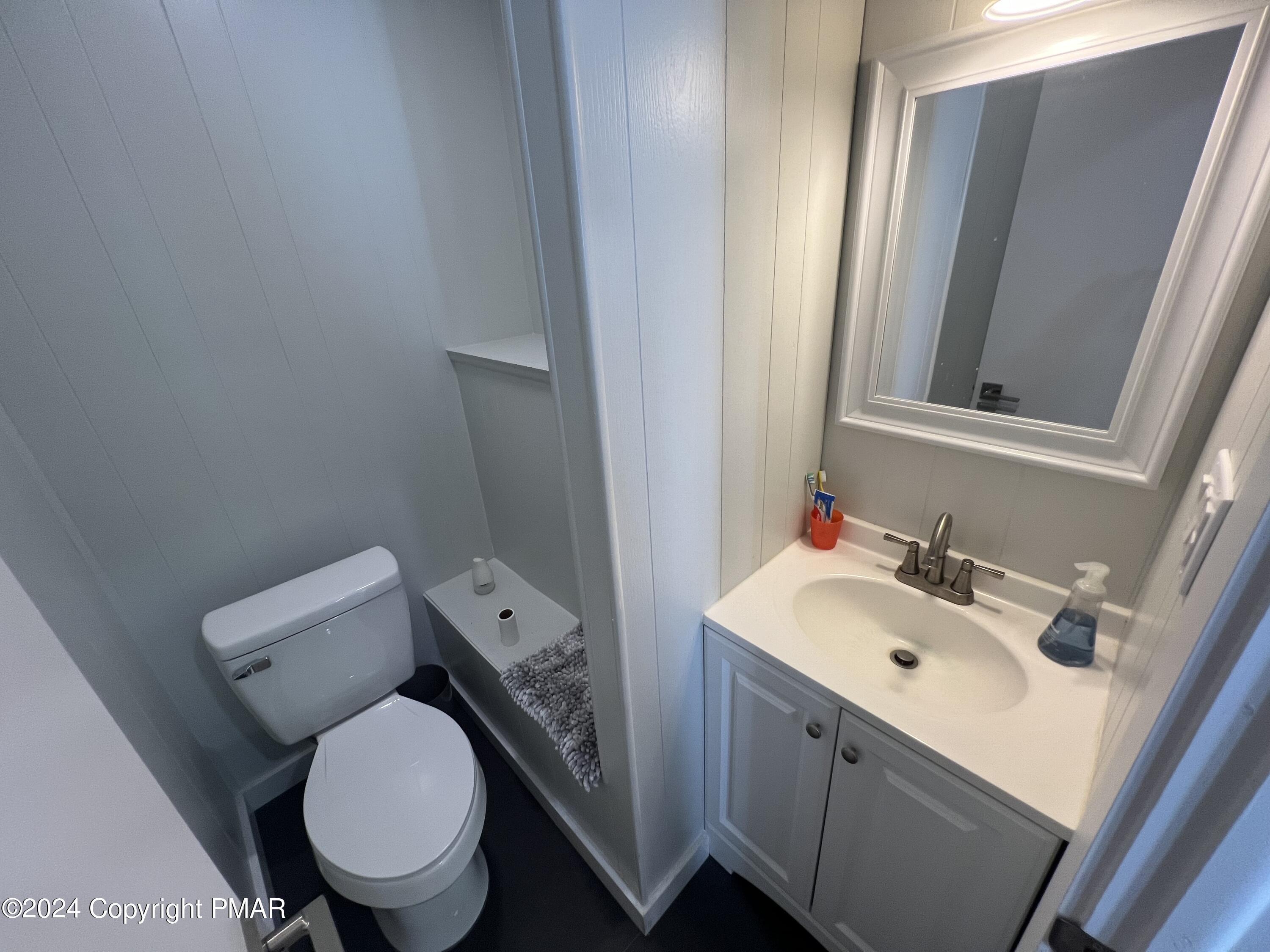 83 Balson Road Stroudsburg, PA 18360 - Photo 16 of 37 a bathroom with a toilet sink and mirror