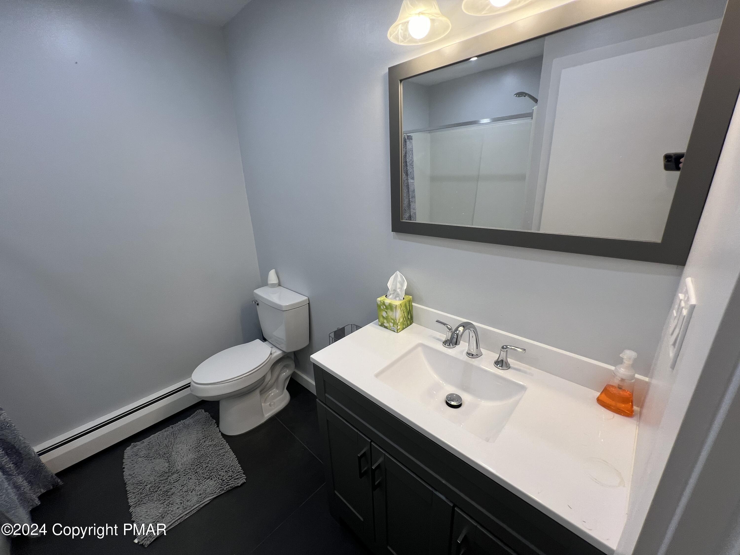 83 Balson Road Stroudsburg, PA 18360 - Photo 17 of 37 a bathroom with a sink toilet and mirror