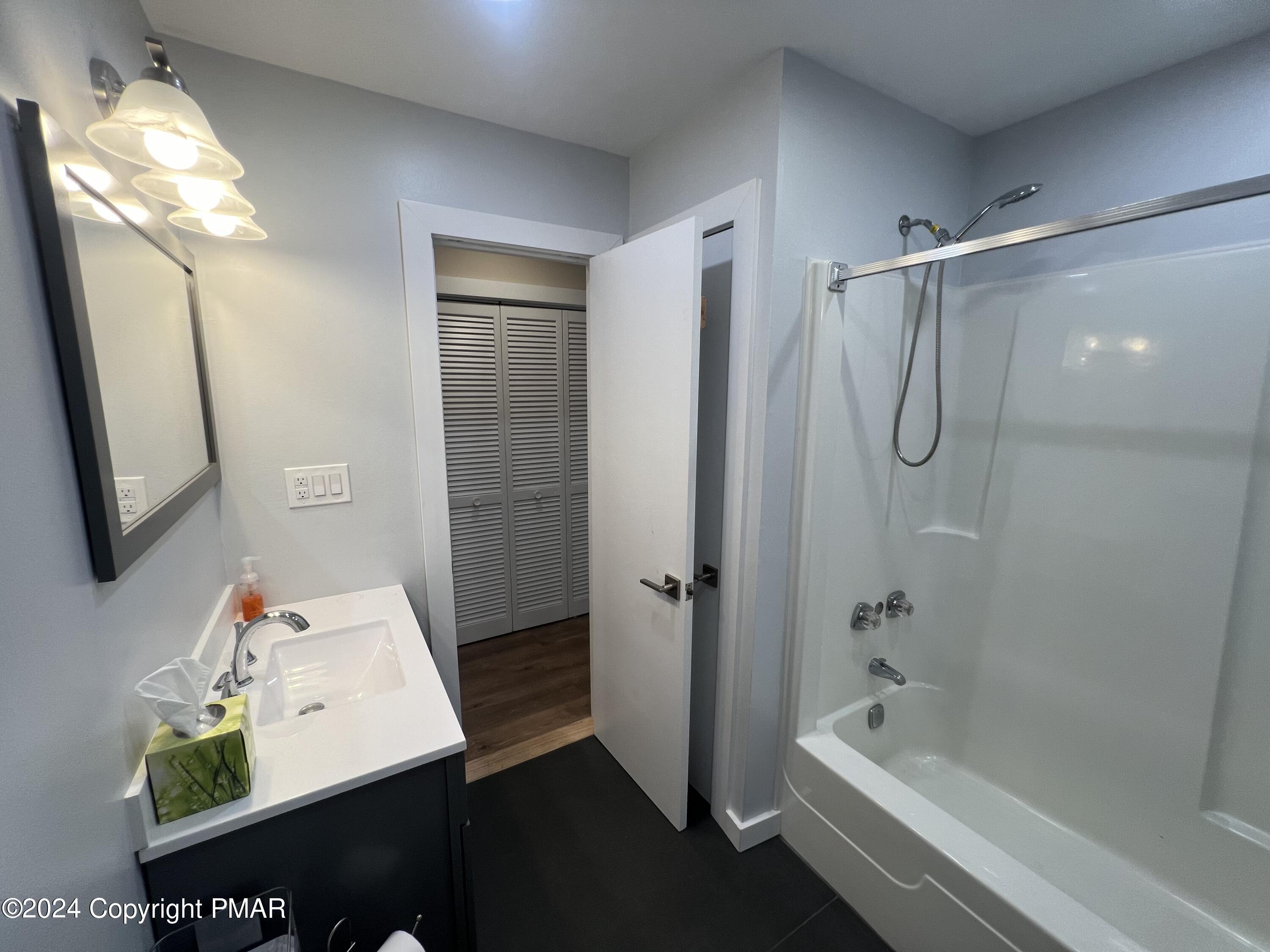 83 Balson Road Stroudsburg, PA 18360 - Photo 18 of 37 a bathroom with a tub a sink and a mirror