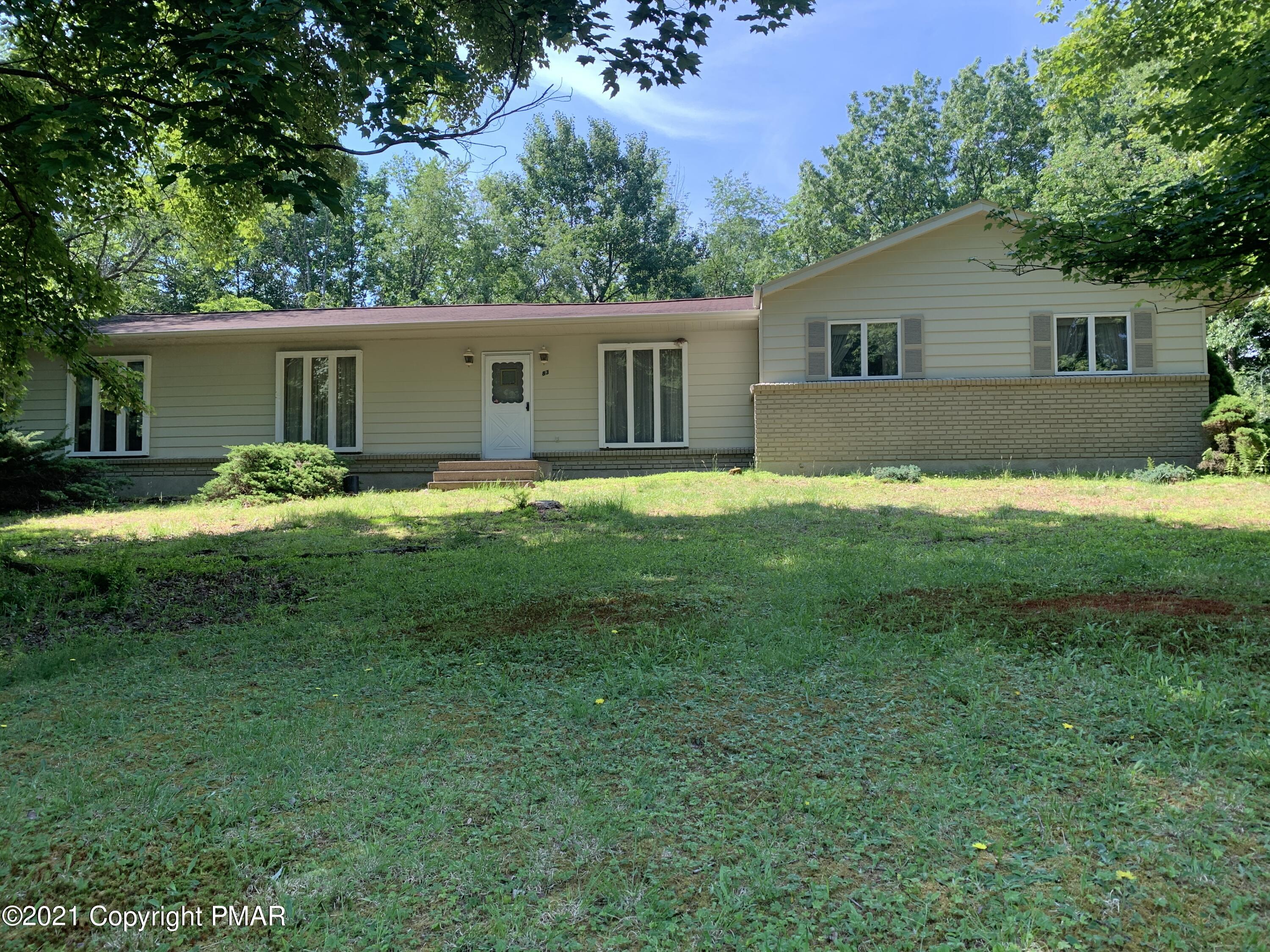 83 Balson Road Stroudsburg, PA 18360 - Photo 2 of 37 a backyard of a house with yard and barbeque oven