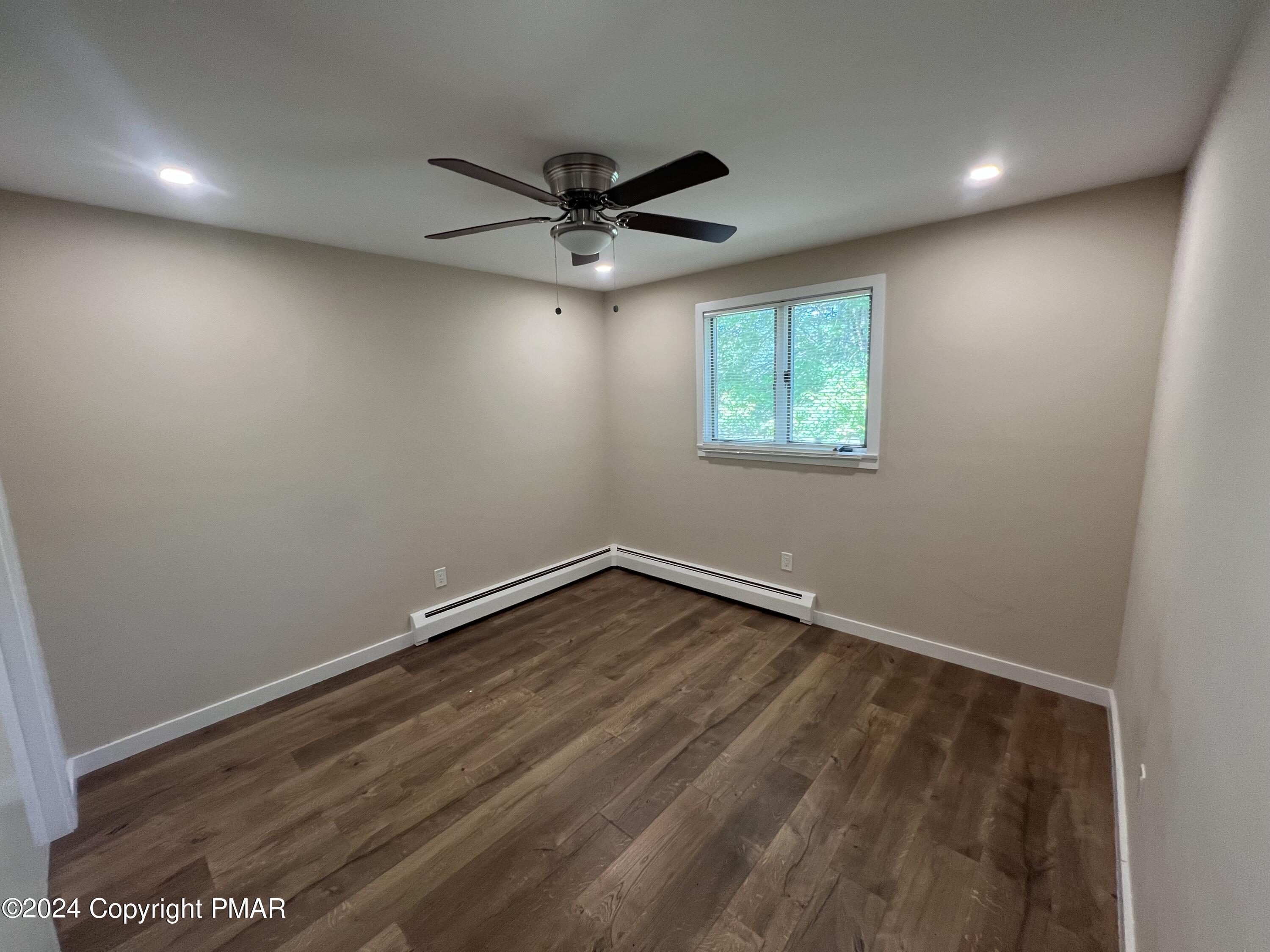 83 Balson Road Stroudsburg, PA 18360 - Photo 23 of 37 an empty room with a window and a ceiling fan