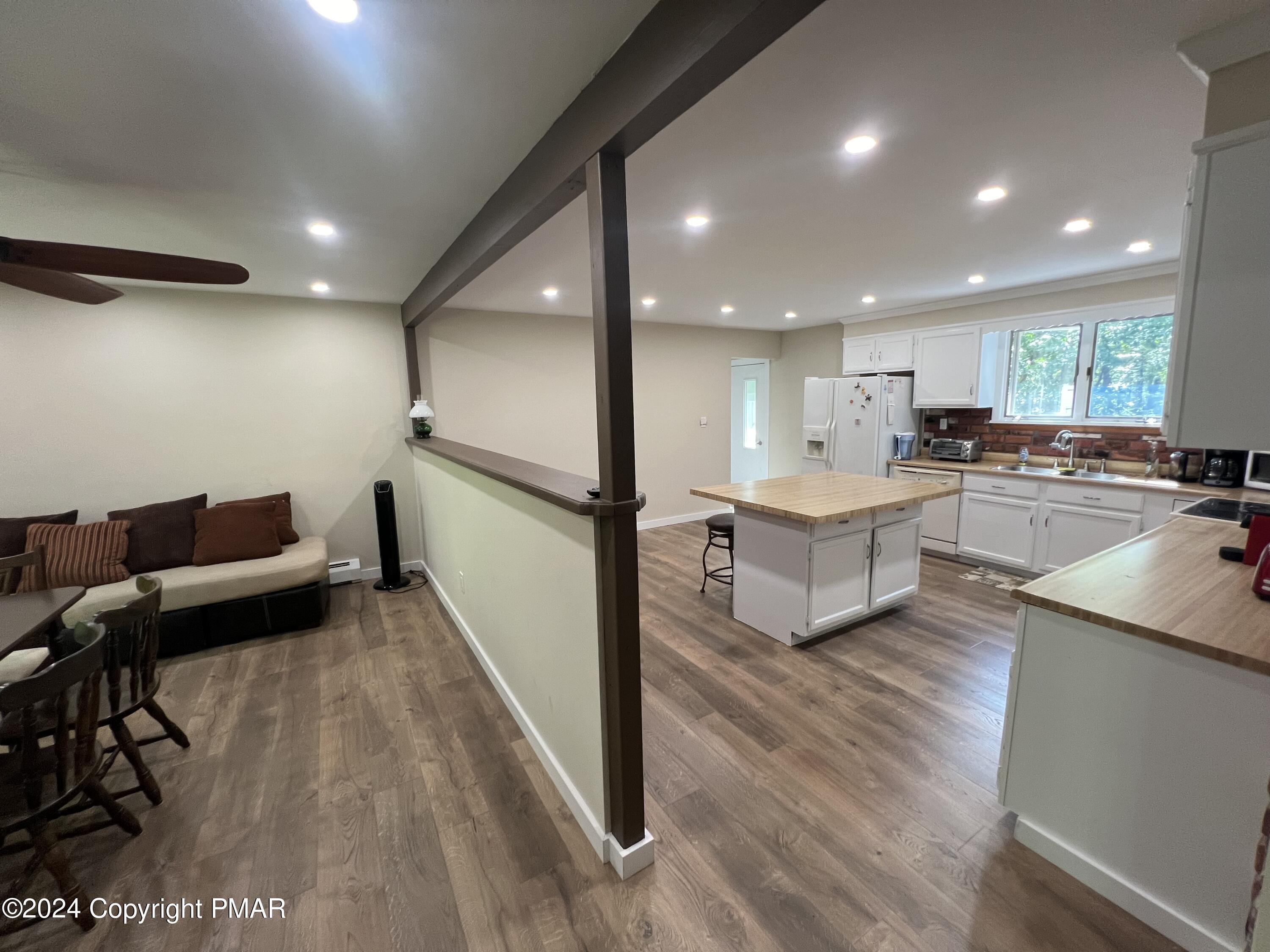 83 Balson Road Stroudsburg, PA 18360 - Photo 8 of 37 a living room with stainless steel appliances furniture and a wooden floor
