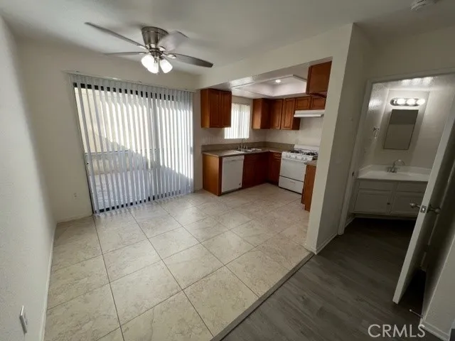 a large kitchen with a large window cabinets and stainless steel appliances