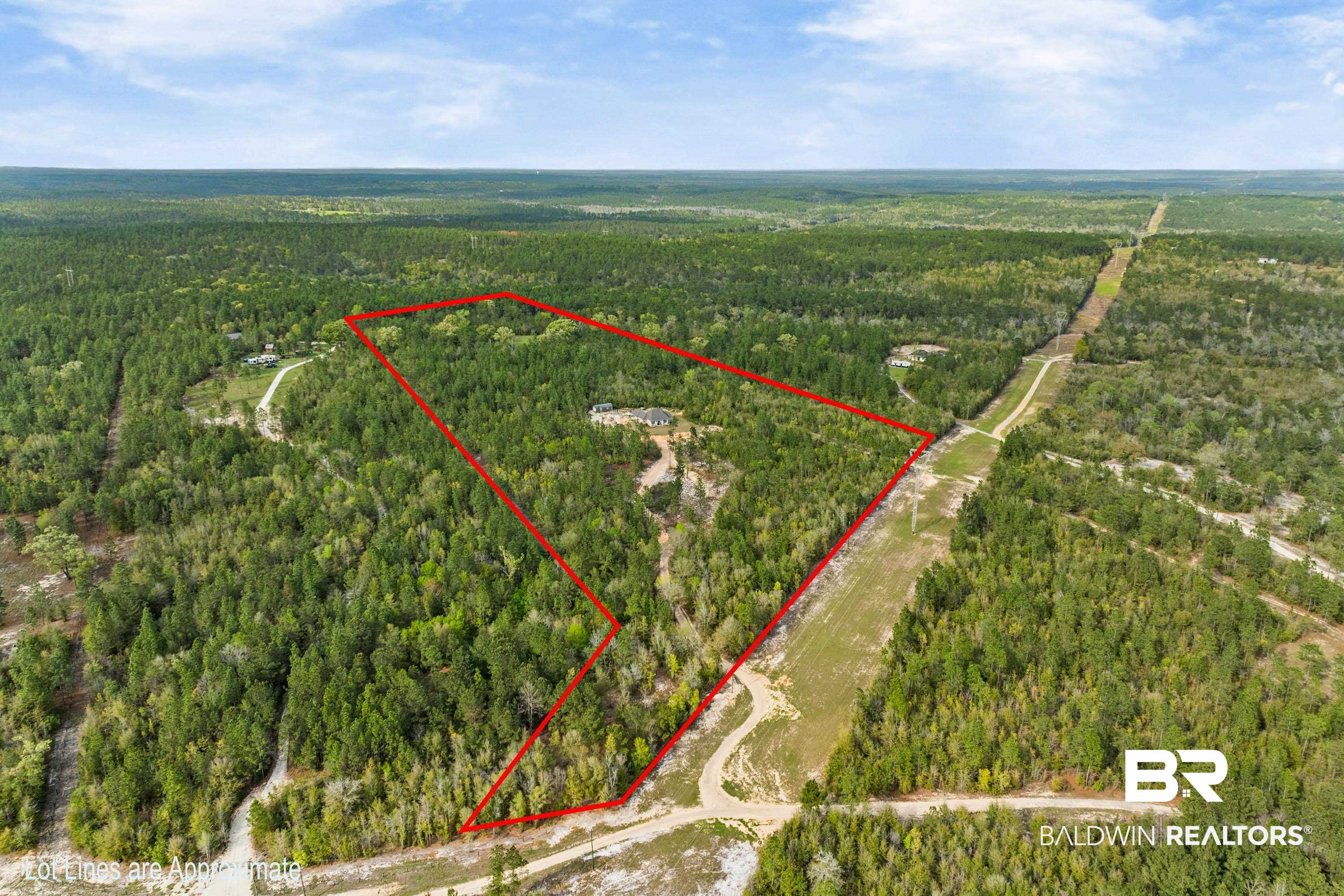 7150 Powell Road, Unit LOT 6A Eight Mile, AL 36613 - Photo 29 of 35 Aerial view of property and surrounding area featuring a heavily wooded area and property boundaries highlighted