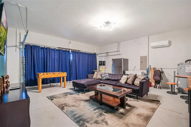 a kitchen with stainless steel appliances granite countertop a stove a sink a refrigerator and cabinets