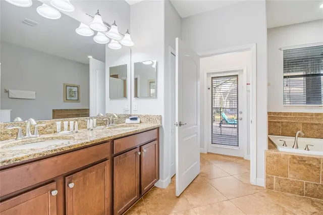 a bathroom with a sink and mirror