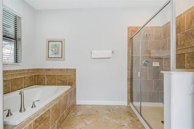 a bathroom with a sink a mirror and a shower