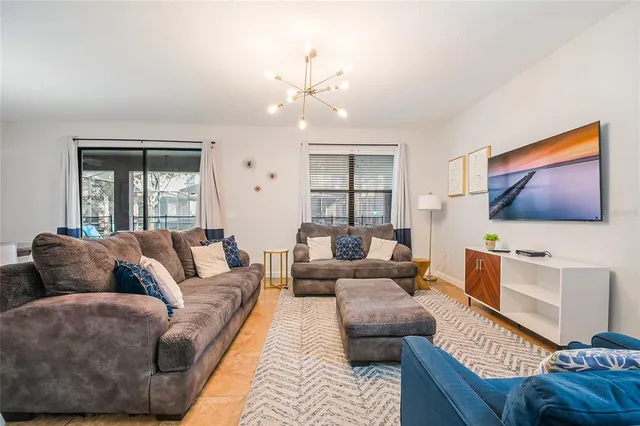 a en suite bathroom with a granite countertop sink mirror and shower
