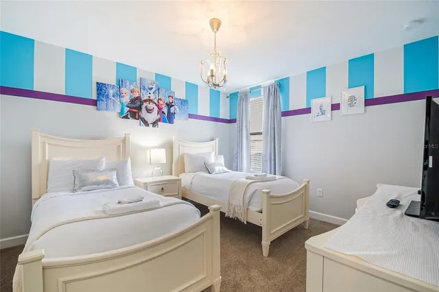 a view of a patio with table and chairs with wooden floor and fence
