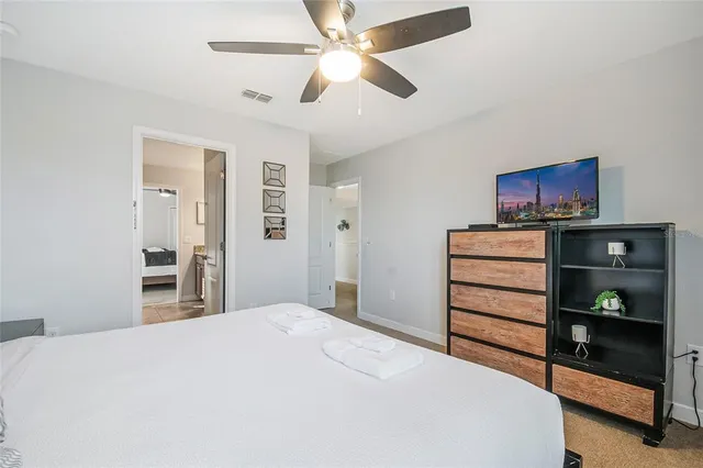 an aerial view of a swimming pool patio and outdoor seating
