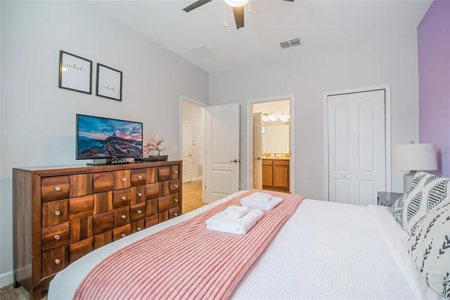 a living room with furniture a rug and a table