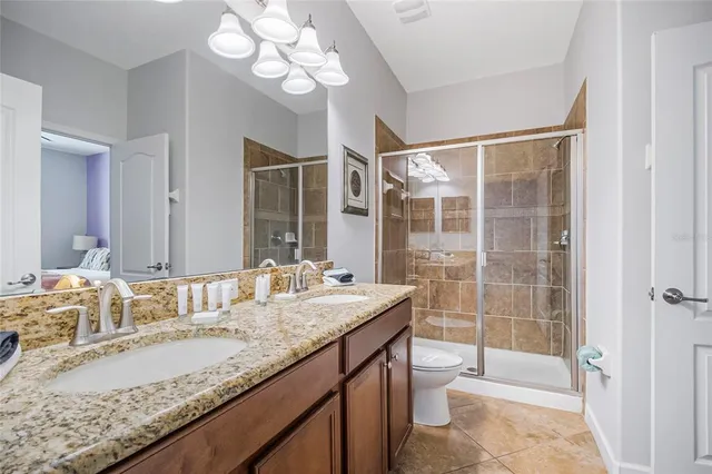 a bathroom with a tub a shower and view