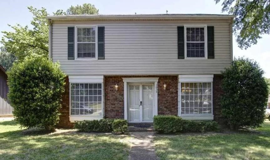 3054 Inverness Pkwy Drive Memphis, TN 38115 - Photo 1 of 1 View of front of home featuring brick siding and a front lawn