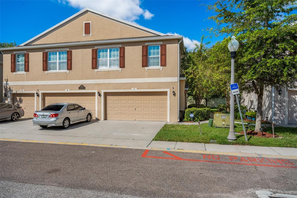 3711 Seneca Club Loop, Unit 2103C Orlando, FL 32808 - Photo 1 of 1 a car parked in front of a house