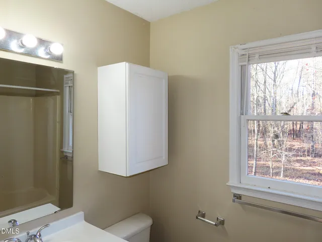 a view of a room with wooden floor and balcony