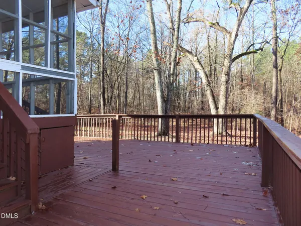 a view of balcony with wooden floor